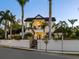 Two-story home with white siding, landscaping, and palm trees at 1810 Lincoln Dr, Sarasota, FL 34236