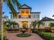 Two-story home with white siding, landscaping, and palm trees at 1810 Lincoln Dr, Sarasota, FL 34236