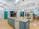 Modern kitchen with large island, granite countertops, and stainless steel appliances at 1810 Lincoln Dr, Sarasota, FL 34236