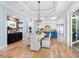 Bright kitchen with granite island, stainless steel appliances, and white cabinetry at 1810 Lincoln Dr, Sarasota, FL 34236