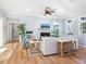 Living room with light walls, hardwood floors, and a cozy fireplace at 1810 Lincoln Dr, Sarasota, FL 34236