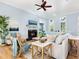 Living room with light walls, hardwood floors, and a cozy fireplace at 1810 Lincoln Dr, Sarasota, FL 34236