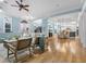 Open concept living room with hardwood floors and views into kitchen area at 1810 Lincoln Dr, Sarasota, FL 34236