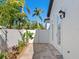 Private patio with stone tile flooring and lush landscaping at 1810 Lincoln Dr, Sarasota, FL 34236