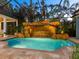 Relaxing pool and spa with a rock waterfall feature at 1810 Lincoln Dr, Sarasota, FL 34236