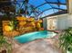 Enjoy the refreshing pool and stunning rock waterfall feature at 1810 Lincoln Dr, Sarasota, FL 34236