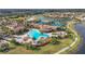 Resort-style community pool, tennis courts, and clubhouse at 20447 Lagente Cir, Venice, FL 34293