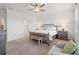 Main bedroom with king-size bed, and seating area at 20447 Lagente Cir, Venice, FL 34293