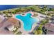 Unique shaped community pool with lounge chairs at 20447 Lagente Cir, Venice, FL 34293