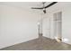 Bedroom with wood-look floors, a closet, and access to an ensuite bathroom at 21907 Cellini Ave, Port Charlotte, FL 33952