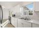 Kitchen featuring stainless steel appliances and views to the backyard at 21907 Cellini Ave, Port Charlotte, FL 33952