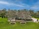 Luxury home with stone accents, landscaping, and a paved driveway at 22343 Panther Loop, Bradenton, FL 34202