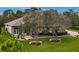 One-story house with a tile roof and manicured lawn at 22343 Panther Loop, Bradenton, FL 34202