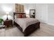Comfortable guest bedroom with wood flooring and simple decor at 22343 Panther Loop, Bradenton, FL 34202