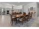 Formal dining room with large wood table and seating for eight at 22343 Panther Loop, Bradenton, FL 34202