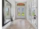 Bright and airy foyer with double doors and large mirror at 22343 Panther Loop, Bradenton, FL 34202