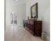 Ornate wooden cabinet in a bright entryway at 22343 Panther Loop, Bradenton, FL 34202