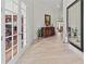 Elegant entryway with hardwood floors and French doors at 22343 Panther Loop, Bradenton, FL 34202