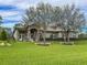 House with stone accents and manicured lawn at 22343 Panther Loop, Bradenton, FL 34202