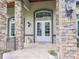 White double front doors with arched window at 22343 Panther Loop, Bradenton, FL 34202