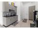 Organized garage with built-in cabinets, sink, and epoxy flooring at 22343 Panther Loop, Bradenton, FL 34202