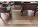 Elegant wood flooring with decorative patterned accents at 22343 Panther Loop, Bradenton, FL 34202