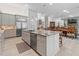 Modern kitchen featuring a large granite island and stainless steel appliances at 22343 Panther Loop, Bradenton, FL 34202