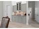 Butler's pantry with gray cabinets and granite countertops at 22343 Panther Loop, Bradenton, FL 34202
