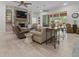 Bright and airy living room with a stone fireplace and ample seating at 22343 Panther Loop, Bradenton, FL 34202