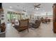 Open concept living area with views into kitchen and backyard pool at 22343 Panther Loop, Bradenton, FL 34202