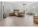Large main bedroom with sitting area and neutral decor at 22343 Panther Loop, Bradenton, FL 34202