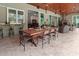 Outdoor kitchen and dining area with a built-in bar and seating at 22343 Panther Loop, Bradenton, FL 34202
