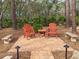 Charming brick patio with wooden chairs and small table at 22343 Panther Loop, Bradenton, FL 34202