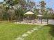 Relaxing pool area with patio and lush landscaping at 22343 Panther Loop, Bradenton, FL 34202