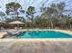 Large, refreshing pool with ample seating and a beautiful view of the surrounding landscape at 22343 Panther Loop, Bradenton, FL 34202