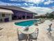 Inviting pool area with spacious patio, comfortable seating, and beautiful landscaping at 22343 Panther Loop, Bradenton, FL 34202