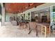 Covered patio with wicker furniture, creating a relaxing outdoor living space at 22343 Panther Loop, Bradenton, FL 34202