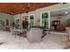 Large covered patio perfect for entertaining, with multiple seating areas at 22343 Panther Loop, Bradenton, FL 34202