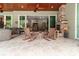 Serene patio with rocking chairs, offering views of the pool and backyard at 22343 Panther Loop, Bradenton, FL 34202