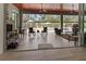 Spacious covered patio with fireplace, comfortable seating, and pool view at 22343 Panther Loop, Bradenton, FL 34202