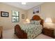 Bedroom with wooden bed frame and matching nightstands at 2340 50Th Street E Cir, Palmetto, FL 34221