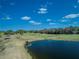 Golf course with pond and clear blue sky at 236 Golden Harbour Trl, Bradenton, FL 34212