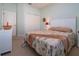 Bright bedroom with a queen-size bed and neutral decor at 236 Golden Harbour Trl, Bradenton, FL 34212