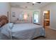 Serene bedroom with wooden bed frame and access to bathroom at 236 Golden Harbour Trl, Bradenton, FL 34212