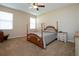 Bright bedroom with wooden bed frame and neutral decor at 236 Golden Harbour Trl, Bradenton, FL 34212