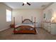 Comfortable bedroom with wooden bed frame and neutral tones at 236 Golden Harbour Trl, Bradenton, FL 34212