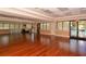 Spacious community room with hardwood floors and large windows at 236 Golden Harbour Trl, Bradenton, FL 34212