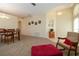 Dining room adjacent to living room with rocking chair at 236 Golden Harbour Trl, Bradenton, FL 34212