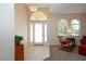 Bright entryway with tile flooring and rocking chair at 236 Golden Harbour Trl, Bradenton, FL 34212