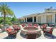 Relaxing fire pit area with wicker chairs at 236 Golden Harbour Trl, Bradenton, FL 34212
